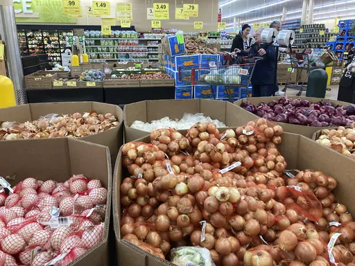 People shop at a grocery store in Buffalo Grove, Ill., Sunday, March 19, 2023. Consumer prices in the United States cooled last month, rising just 0.1% from April to May and extending the past year's steady easing of inflation. (AP Photo/Nam Y. Huh)