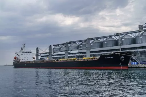 The ship Navi-Star sits full of grain since Russia's invasion of Ukraine began five months ago as it waits to sail from the Odesa Sea Port, in Odesa, Ukraine, July 29, 2022. U.S. President Joe Biden has warned that global hunger could increase because of Russia’s suspension of a U.N.-brokered deal to allow safe passage for ships carrying Ukrainian grain. (AP Photo/David Goldman, File)