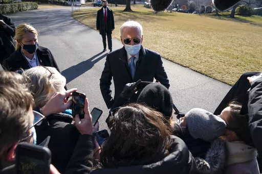 President Joe Biden talks with reporters after arriving on the South Lawn of the White House, on Feb. 8, 2021, in Washington. (AP Photo/Evan Vucci, File)