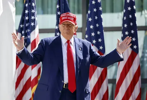 Republican presidential candidate former President Donald Trump enters at a campaign event, June 18, 2024, in Racine, Wis. Former President Donald Trump's sentencing in his hush money case has been postponed until Sept. 18. (AP Photo/Jeffrey Phelps, File)