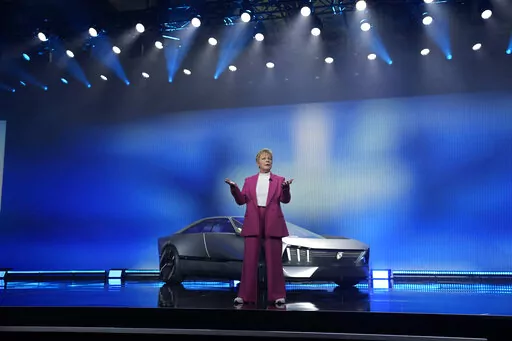 Peugeot CEO Linda Jackson unveils the Peugeot Inception Concept car during the Stellantis keynote at the CES tech show Thursday, Jan. 5, 2023, in Las Vegas. (AP Photo/John Locher)