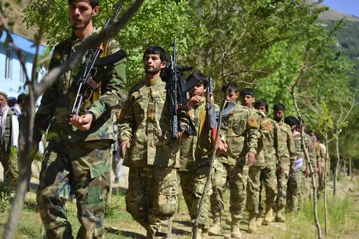 FILE- Militiamen loyal to Ahmad Massoud, son of the late Ahmad Shah Massoud, take part in a training exercise, in Panjshir province, northeastern Afghanistan, on Aug. 29, 2021. Taliban security forces in northern Afghanistan have unlawfully detained and tortured residents accused of association with an opposition armed group, New York-based Human Rights Watch said in a statement Friday, June 10, 2022. (AP Photo/Jalaluddin Sekandar, File)
