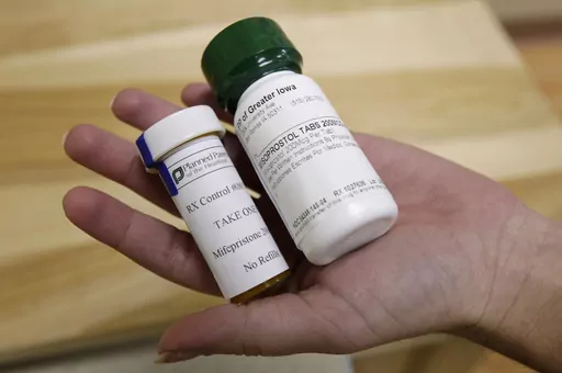 Bottles of abortion pills mifepristone, left, and misoprostol, right, at a clinic, Sept. 22, 2010, in Des Moines, Iowa. A judge in Wyoming will decide as soon as Thursday, Dec. 14, 2023, whether to strike down, uphold or hold a trial over the state's abortion bans including its first-in-the-nation explicit ban on abortion pills. (AP Photo/Charlie Neibergall, File)