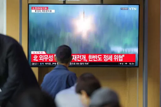 A TV screen showing a news program reporting about North Korea's missile launch with file footage, is seen at the Seoul Railway Station in Seoul, South Korea on Oct. 6, 2022. The nuclear-powered aircraft carrier USS Ronald Reagan launched a new round of naval drills with South Korean warships on Friday, a day after North Korea fired more ballistic missiles and flew warplanes in an escalation of its weapons tests. (AP Photo/Lee Jin-man, File)
