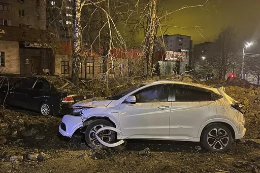 This handout photo released by Telegram Channel of Belgorod Region Governor Vyacheslav Gladkov shows the site of the crater after an explosion in Belgorod, Russia, Friday, April 21, 2023. A large explosion hit Belgorod late Thursday, and the Defense Ministry said one of its Su-34 warplanes accidentally discharged ammunition over the city about 25 km (15 miles) from the Ukrainian border. Belgorod Regional Gov. Vyacheslav Gladkov said the blast injured at least two people, damaged homes and left a