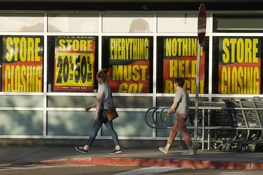 Shoppers enter exit a Bed Bath & Beyond store Monday, May 29, 2023, in Glendale, Colo. The big-box chain is staging store closing sales at its 360 locations after filing for bankruptcy in late April 2023. An Associated Press analysis found the number of publicly-traded “zombie” companies — those so laden with debt they're struggling to pay even the interest on their loans — has soared to nearly 7,000 around the world, including 2,000 in the United States. (AP Photo/David Zalubowski, File