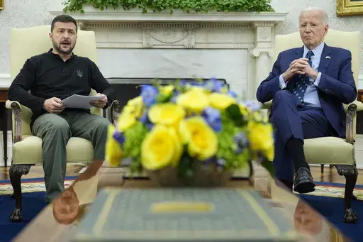 President Joe Biden, right, listens as Ukraine's President Volodymyr Zelenskyy, left, speaks during their meeting in the Oval Office of the White House in Washington, Sept. 26, 2024. (AP Photo/Susan Walsh, File)
