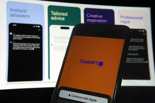 OpenAI's ChatGPT app is displayed on an iPhone in New York, May 18, 2023. The rate of businesses in the U.S. using AI is still relatively small but growing rapidly, with firms in information technology and professional services, and in locations like Colorado and the District of Columbia, leading the way, according to a new paper from U.S. Census Bureau researchers. (AP Photo/Richard Drew, File)