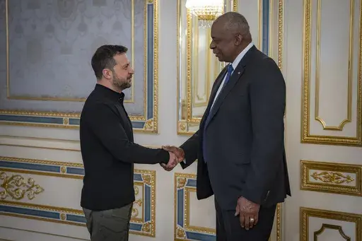 In this photo provided by the Press Service Of The President Of Ukraine on Oct. 21, 2024, U.S. Secretary of Defense Lloyd Austin, right, and Ukraine's President Volodymyr Zelenskyy shake hands during their meeting in Kyiv, Ukraine. (Press Service Of The President Of Ukraine via AP)