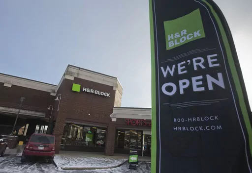 An ad banner appears in the parking lot of the H&R Block offices on Thursday, Jan. 8, 2015, in the Atlas District in Washington. (AP Photo/Pablo Martinez Monsivais, File)