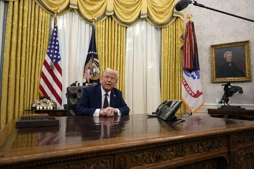 President Donald Trump answers questions from reporters as he signs an executive orders in the Oval Office of the White House, Jan. 23, 2025, in Washington. (AP Photo/Ben Curtis, File)