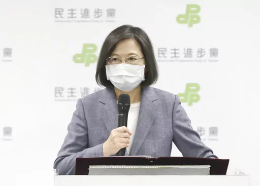 Taiwan President Tsai Ing-wen announces her resignation as party chairwoman of Democratic Progressive Party in Taipei, Taiwan, Saturday, Nov. 26, 2022. Voters in Taiwan overwhelmingly chose the opposition Nationalist party in several major races across the self-ruled island in an election Saturday in which lingering concerns about threats from China took a backseat to more local issues. (AP Photo/Chiang Ying-ying)