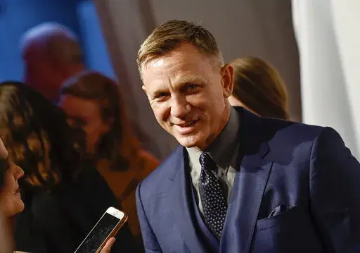 Actor Daniel Craig attends The Opportunity Network's 11th Annual Night of Opportunity Gala at Cipriani Wall Street, Monday, April 9, 2018 in New York. Could it be the curse of the Scottish play? Daniel Craig’s return to Broadway in a new version of “Macbeth” has been temporarily halted after the actor contracted COVID-19. (Photo by Evan Agostini/Invision/AP, File)