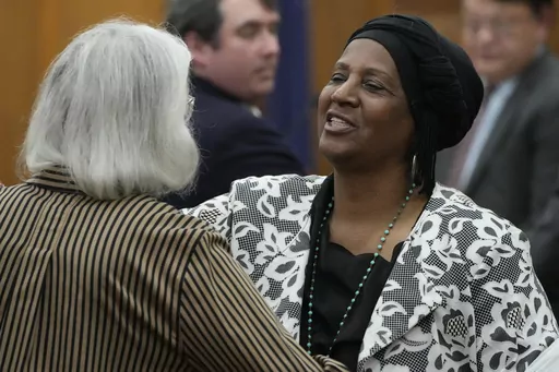 Sabreen Sharrief, right, reaches out to hug fellow plaintiff Dorothy Triplett after testifying at a hearing May 10, 2023, in Hinds County Chancery Court in Jackson, Miss., where a judge heard arguments about a Mississippi law that would allow some circuit judges to be appointed rather than elected. The Mississippi Supreme Court issued a ruling Thursday, Sept. 21, 2023, striking down the part of the law dealing with four appointed circuit judges for Hinds County. (AP Photo/Rogelio V. Solis, File)