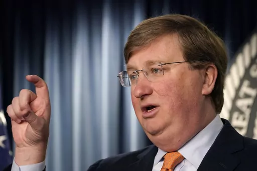 Mississippi Republican Gov. Tate Reeves answers a reporter's question on his announcement of a tech company expected to invest $10 billion to build two data processing centers that will create 1,000 jobs in central Mississippi, during a Wednesday, Jan. 24, 2024, news conference in Jackson, Miss. (AP Photo/Rogelio V. Solis)