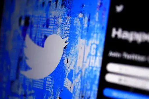 The Twitter splash page is seen on a digital device, Monday, April 25, 2022, in San Diego. Elon Musk’s more unfettered version of Twitter could collide with new rules in Europe. Officials warn the social media company will have to comply with some of the world’s toughest laws targeting toxic content. (AP Photo/Gregory Bull, File)