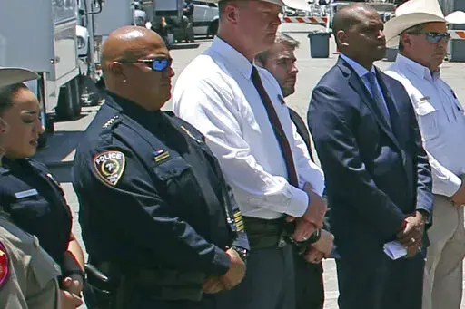 Uvalde School Police Chief Pete Arredondo, second from left, stands during a news conference outside of the Robb Elementary school in Uvalde, Texas, on May 26, 2022. The Uvalde school district’s police chief has stepped down from his position in the City Council just weeks after being sworn in following allegations that he erred in his response to the mass shooting at Robb Elementary School that left 19 students and two teachers dead.  (AP Photo/Dario Lopez-Mills, File)