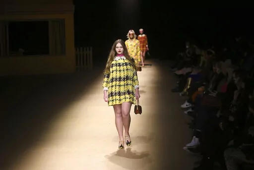Models walks the runway wearing the Coach Fall/Winter 2022 collection during Fashion Week on Monday, Feb. 14, 2022, in New York. (AP Photo/John Carucci)