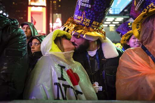 A couple kisses in Times Square as they attend the New Year's Eve celebrations on Saturday, Dec. 31, 2022, in New York. (AP Photo/Stefan Jeremiah)