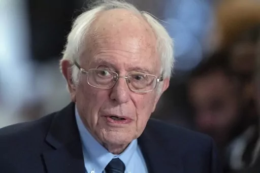 Sen. Bernie Sanders, I-Vt., talks to the media as he walks to the House chamber before President Joe Biden's State of the Union address at the U.S. Capitol Thursday, March 7, 2024, in Washington. Police in Vermont are seeking a suspect who allegedly started a fire Friday, April 5, 2024, outside the office of U.S. Sen. Bernie Sanders. The small blaze caused minor damage but no injuries. (AP Photo/Jose Luis Magana, File)