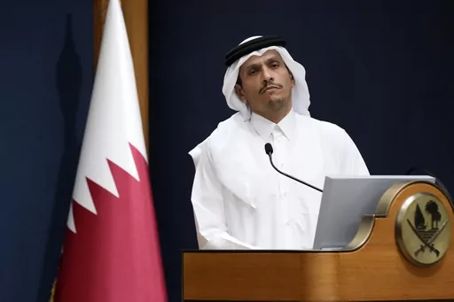 Qatar's Prime Minister and Foreign Minister Mohammed bin Abdulrahman Al Thani listens a question with U.S. Secretary of State Antony Blinken in Doha, Qatar, Friday Oct. 13, 2023. Qatar is the go-to mediator in the Israel-Hamas war. On Saturday, Nov. 25, 2023, a Qatari jet landed in Israel's Ben-Gurion International Airport with an urgent task: save the cease-fire deal between Israel and Gaza's Hamas rulers. (AP Photo/Jacquelyn Martin, Pool, File)