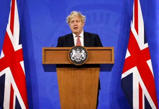 Britain's Prime Minister Boris Johnson speaks during a media briefing in Downing Street, London,  Monday Feb. 21, 2022, to outline the Government's new long-term COVID-19 plan. (Tolga Akmen/Pool via AP)