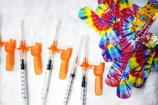 Syringes and colorful bandages are prepared as children from local schools prepare to get COVID-19 vaccines in Pittsfield, Mass., on Monday Dec. 13, 2021. (Ben Garver/The Berkshire Eagle via AP, File)