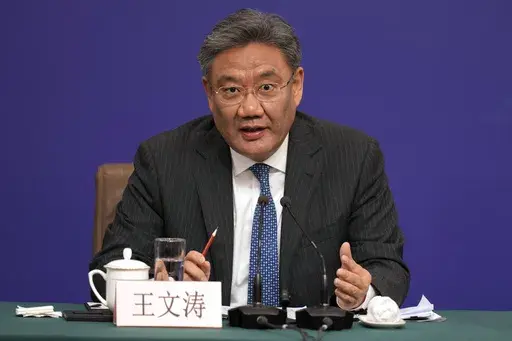 Chinese Commerce Minister Wang Wentao speaks at a press conference on the sideline of the National People's Congress in Beijing, Wednesday, March 6, 2024. (AP Photo/Ng Han Guan, File)