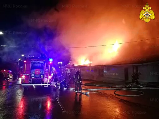 In this handout photo released by the Russian Emergency Ministry Press Service, firefighters try to extinguish a fire at a cafe in Kostroma, Russia, Saturday, Nov. 5, 2022. Russia emergency officials said the fire killed multiple people in Kostroma, north of Moscow. (Russian Emergency Ministry Press Service via AP)