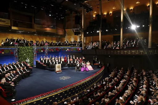 The Nobel laureates and the royal family of Sweden during the Nobel Prize award ceremony at the Concert Hall in Stockholm, Saturday Dec. 10 2022. The Nobel Foundation has withdrawn its invitation for representatives of Russia, Belarus and Iran to attend this year’s Nobel Prize award ceremonies after the decision to invite them “provoked strong reactions.” Saturday's U-turn came after several Swedish lawmakers said they would boycott this year’s Nobel Prize award ceremonies. (Pontus Lunda