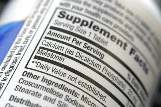 The label for a bottle of melatonin pills is seen in New York on Thursday, June 2, 2022. Melatonin is a hormone that helps control the body's sleep cycle. (AP Photo/Patrick Sison)