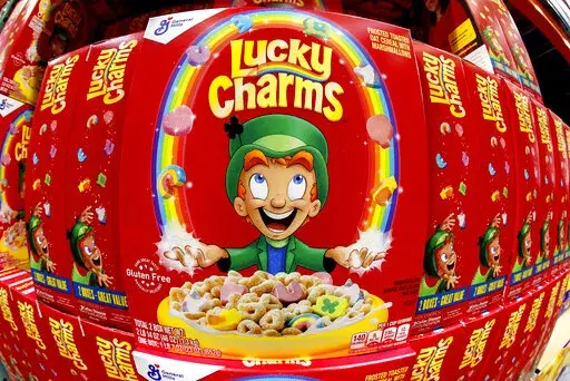 Boxes of General Mills' Lucky Charms cereal are seen on a shelf at a Costco Warehouse in Robinson Township, Pa., Thursday, May 14, 2020. On Saturday, April 16, 2022, the U.S. Food and Drug Administration said that it is investigating Lucky Charms cereal after dozens of customers complained of illness after eating the product. (AP Photo/Gene J. Puskar, File)