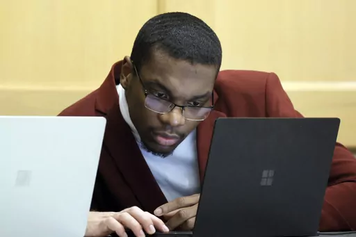 Shooting suspect Michael Boatwright looks at his attorney's computer at the defense table on the fourth day of jury deliberations in the XXXTentacion murder trial at the Broward County Courthouse in Fort Lauderdale, Fla., Monday, March 13, 2023. Emerging rapper XXXTentacion, born Jahseh Onfroy, 20, was killed during a robbery outside of Riva Motorsports in Pompano Beach in 2018, allegedly by defendants Boatwright, Trayvon Newsome, and Dedrick Williams. (Amy Beth Bennett/South Florida Sun-Sentine