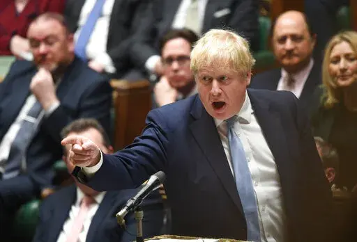 In this photo made available by UK Parliament, Britain's Prime Minister Boris Johnson speaks in the Houses of Commons, London, Monday Jan. 31, 2022. Boris Johnson apologized for lockdown-flouting parties at 10 Downing Street and insisted that he and his government can be trusted. Johnson told lawmakers in the House of Commons on Monday that he would make changes to the way the government is run in the wake of the “partygate” scandal. (Jessica Taylor/UK Parliament via AP)