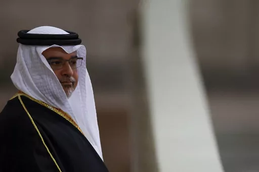 Bahrain's Crown Prince and Prime Minister Salman bin Hamad Al Khalifa pays his respects to the coffin of Britain's Queen Elizabeth, following her death, during her lying-in-state at Westminster Hall, in London, Sunday Sept. 18, 2022. The websites of two government ministries in Bahrain briefly became inaccessible Tuesday, Nov. 21, 2023, after a statement claimed hackers took them down over the island kingdom's stance on the ongoing Israel-Hamas war.(John Sibley/Pool via AP, File)