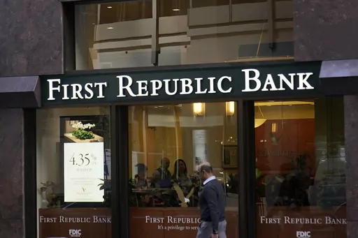 A pedestrian walks past a First Republic Bank in San Francisco on April 26, 2023. Regulators continued their search for a solution to First Republic Bank’s woes over the weekend before stock markets were set to open Monday, May 1. (AP Photo/Jeff Chiu, File)