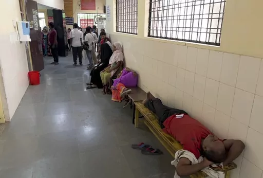 People wait to consult doctors at Tej Bahadur Sapru Hospital in Prayagraj, Uttar Pradesh state, India, Thursday, June 23, 2022. At least 34 people have died in the past two days as a large swath of the north Indian state of Uttar Pradesh swelters under severe heat, officials said Saturday, prompting doctors to advise citizens above 60 years of age against venturing out during the daytime. (AP Photo/Rajesh Kumar Singh, File)