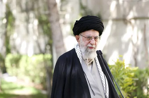In this picture released by the official website of the office of the Iranian supreme leader, Supreme Leader Ayatollah Ali Khamenei speaks after planting a tree marking National Tree Planting Day, at the courtyard of his office in Tehran, Iran, Monday, March 6, 2023. Khamenei said Monday that if a series of suspected poisonings at girls' schools are proven to be deliberate the culprits should be sentenced to death for committing an "unforgivable crime." (Office of the Iranian Supreme Leader via 