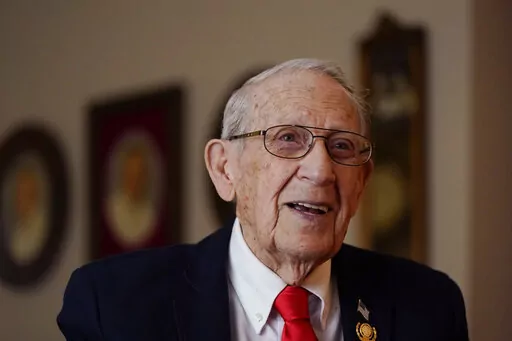 CORRECTS DATE TO APRIL 7 - World War II veteran Art Fishman is interviewed, Monday, April 4, 2022, in Oak Park, Mich. Fishman's dream of a Michigan state World War II memorial is about to take one more step toward reality. Fishman, who sailed on a Navy destroyer in the Pacific theater as an 18-year-old, was to be among those on hand Thursday, April 7 when ground is broken for The Michigan WWII Legacy Memorial in Royal Oak, Mich. (AP Photo/Carlos Osorio)