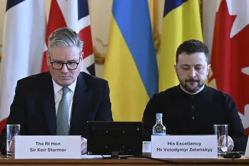 Britain's Prime Minister Keir Starmer, left, and Ukraine's President Volodymyr Zelenskyy at the European leaders' summit to discuss Ukraine, at Lancaster House, London, Sunday March 2, 2025. (Justin Tallis/Pool via AP)