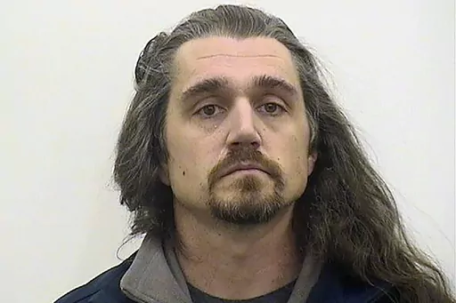 This booking image provided by Adams County, Illl., administration, shows Timothy Bliefnick of Quincy, Ill., who has been charged charged with first-degree murder in the death of his estranged wife, Rebecca Bliefnick. On Friday, Aug. 11, 2023, a judge sentenced Bliefnick, a former contestant on the television game show “Family Feud,” to life in prison after he was convicted of first-degree murder in the slaying of his estranged wife in western Illinois. (Adams County, Illl., Administration v