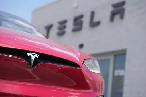 An unsold 2023 Model X sports-utility vehicle sits outside a Tesla dealership June 18, 2023, in Littleton, Colo. Tesla is recalling more than 2 million vehicles across its model lineup to fix a defective system that's supposed to ensure drivers are paying attention when they use Autopilot. (AP Photo/David Zalubowski, File)