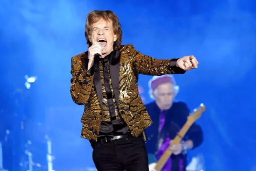 Mick Jagger, of the Rolling Stones, performs during the band's "No Filter" tour on Monday, Nov. 15, 2021, at Ford Field in Detroit. The Rolling Stones plan to release what they’re calling their “ultimate live greatest hits album,” with appearances by Lady Gaga, Bruce Springsteen, Gary Clark Jr. and The Black Keys, early next year.“GRRR Live!” contains songs recorded live on Dec. 15, 2012, at Newark, New Jersey’s Prudential Center. (Photo by Rob Grabowski/Invision/AP, File)