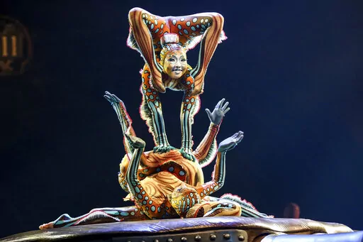 Cast members from Cirque du Soleil perform on stage during the "KURIOS - Cabinet of Curiosities" premiere in Los Angeles on Dec. 9, 2015. Cirque du Soleil is planning a brand new, eye-popping show, “Mad Apple” on the Las Vegas Strip this spring. It will feature stand-up comedians, close-up magic and a live band playing pop music alongside its famous acrobats and contortionists.  (Photo by Rich Fury/Invision/AP, File)