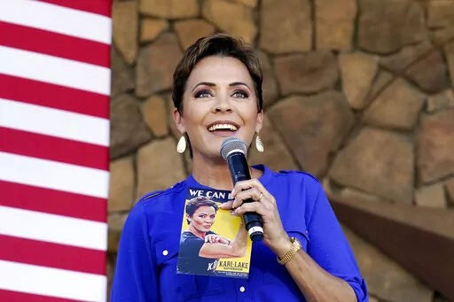 Republican gubernatorial candidate Kari Lake speaks to supporters at a campaign event in Queen Creek, Ariz., Oct. 5, 2022. Lake lost the race for Arizona governor last year but she built a loyal following that stretches far beyond the state. Her meteoric rise is virtually unheard of for a first-time candidate who started her campaign with no national profile. (AP Photo/Ross D. Franklin, File)