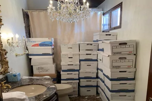 This image, contained in the indictment against former President Donald Trump, shows boxes of records stored in a bathroom and shower in the Lake Room at Trump's Mar-a-Lago estate in Palm Beach, Fla. The classified documents investigation of Donald Trump appeared to have clear momentum in 2022 when FBI agents who searched the former president’s Mar-a-Lago estate recovered dozens of boxes containing sensitive documents. But each passing day brings mounting doubts that the case can reach trial t