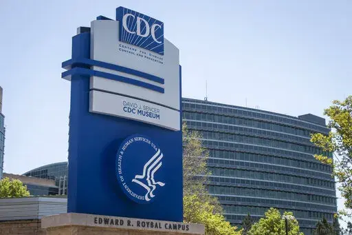 A Centers for Disease Control and Prevention sign stands at the entrance of their offices in Atlanta on Tuesday, April 19, 2022. On Wednesday, Aug. 17, 2022, the head of nation's top public health agency announced a shake-up of the organization, in a bid to respond to ongoing criticism and try to make it more nimble. (AP Photo/Ron Harris, File)