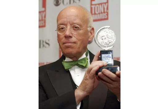 Eugene Lee poses with his Tony Award for Best Scenic Design for "Wicked" at the Tony Awards in New York on June 6, 2004. Lee, the six-time Emmy Award-winning production designer for “Saturday Night Live” and who won three Tony Awards for his Broadway sets, died Tuesday in Providence, R.I. He was 83. (AP Photo/Richard Drew, File)
