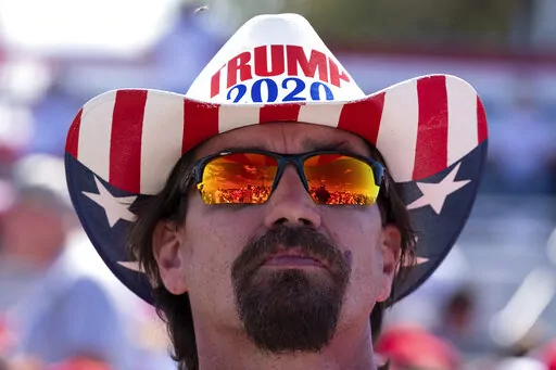 Frank Garner waits for the start of former President Donald Trump's rally in Perry, Ga., on Sept. 25, 2021. (AP Photo/Ben Gray, File)