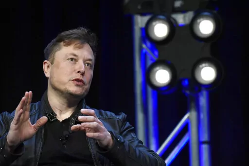 Tesla and SpaceX Chief Executive Officer Elon Musk speaks at the SATELLITE Conference and Exhibition in Washington. A federal judge on Friday, Jan. 13 2023 rejected Tesla CEO Elon Musk’s bid to move or delay a trial over a misleading tweet about a potential buyout of the electric automaker, setting the stage for the mercurial billionaire to be thrust into a legal drama amid the turmoil of his Twitter takeover. (AP Photo/Susan Walsh, File)